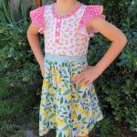 Rosa Baumwollkleider für Kinder mit Zitronenmotiv mit Rüschen aus Baumwolle für den für den Sommer 